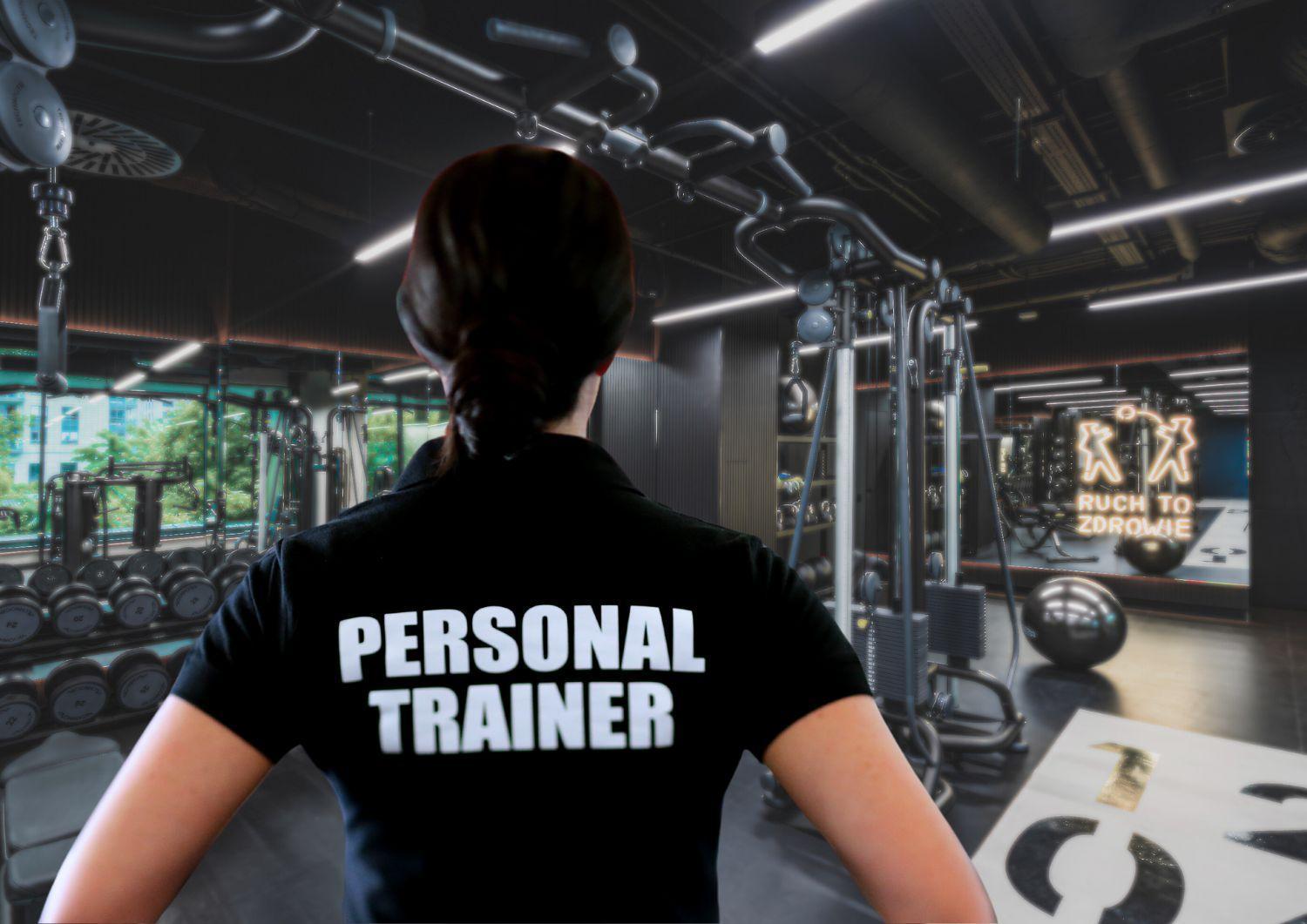 Royal Tulip Warsaw Centre 아파트 호텔 외부 사진 The image shows the back of a person wearing a black shirt with the words "PERSONAL TRAINER" printed in large white letters. The setting appears to be a gym, featuring various workout equipment and weightlifting machines in the background. There are 